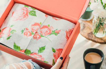 A Box With Coral Floral Wrapping Paper