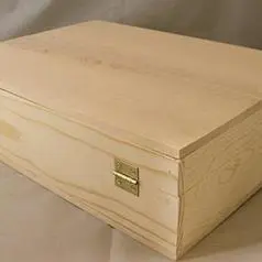 A Wooden Box With Brass Hinges
