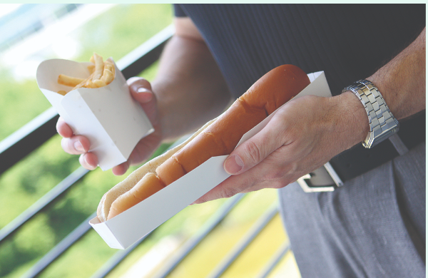Screenshot 2024-07-02 173416 Man holding fries and hot dog.