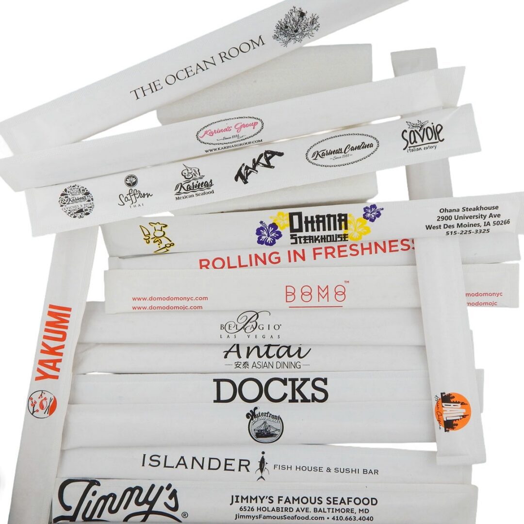 Stack of custom printed paper wrapped chopstick sets branded for restaurants