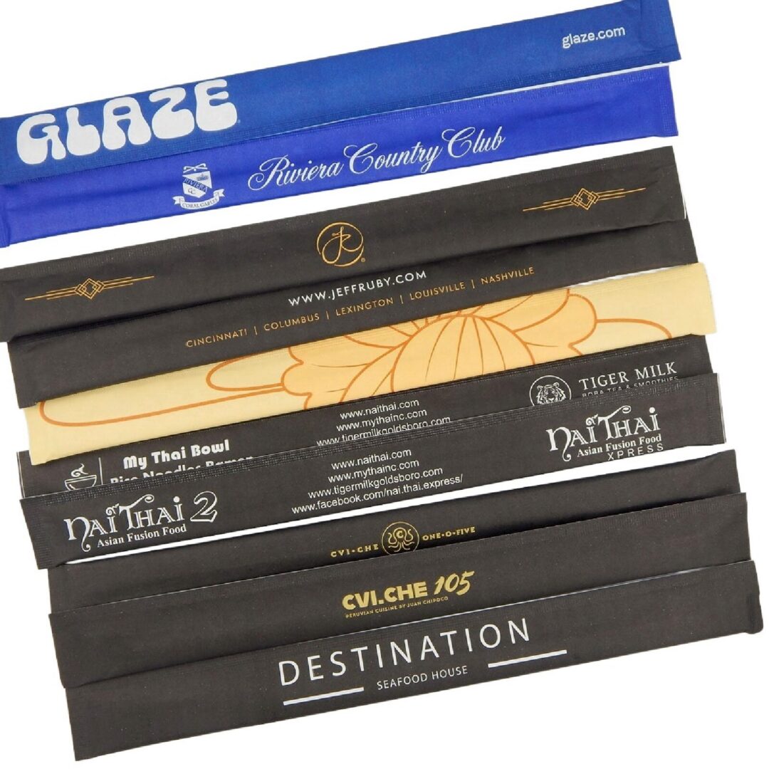 Custom printed chopstick sleeves in color with restaurant and club logos